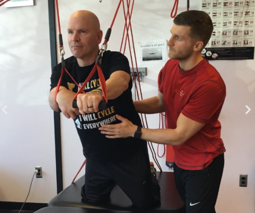 The Recovery Project employee working with a patient